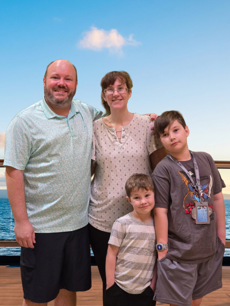 Joseph Jessica Nolan and Nelson on deck of a ship with the ocean in the background